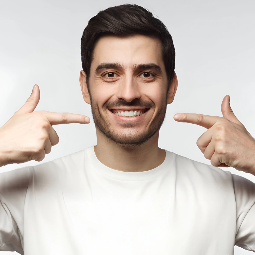 Finding an NHS Dentist in Bradford And What to Do If None Are Accepting Patients 5 portrait smiling young man pointing his perfect natural white teeth after whitening treatment dental clinic ads concept ezgif.com optiwebp