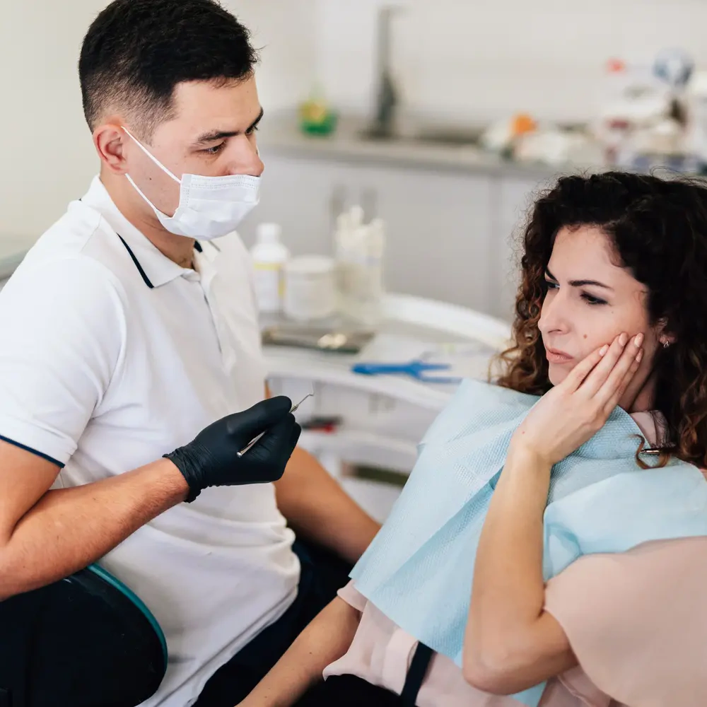 Cost of Dental Treatment in Bradford: NHS Prices vs Private Dentists Explained 3 woman with toothache dentist ezgif.com optiwebp