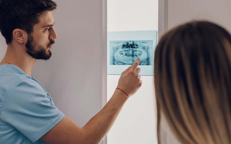 group-of-doctors-looking-at-x-ray-image-from-jaw-KW3B2PG.jpg